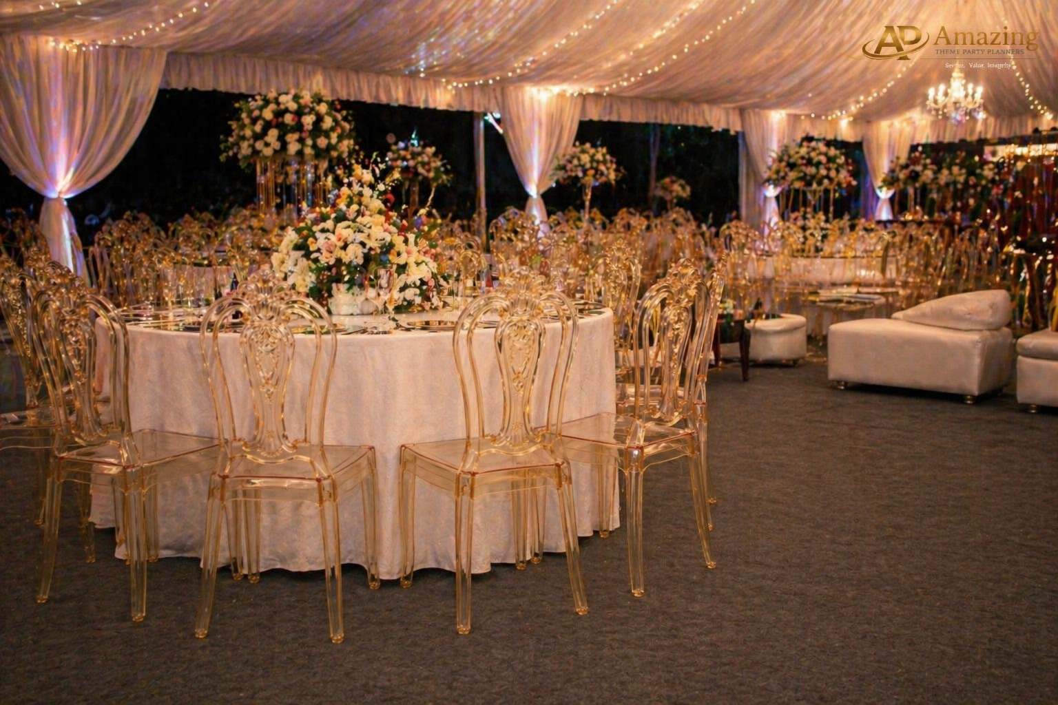 Gold ghost chairs arranged inside a Nairobi marquee tent wedding reception