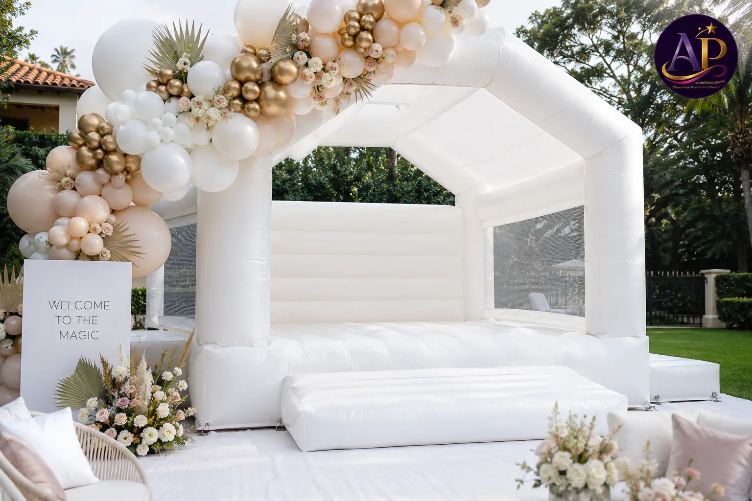 White Bounce House with Balloon Garland