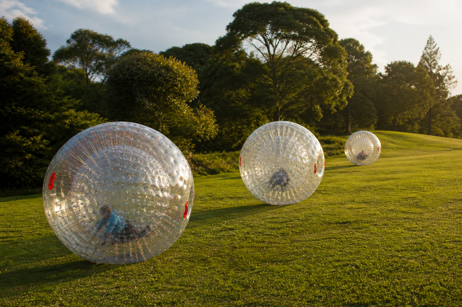 zorb ball hire Nairobi setup with multiple inflatable bubble balls in Karen open lawn